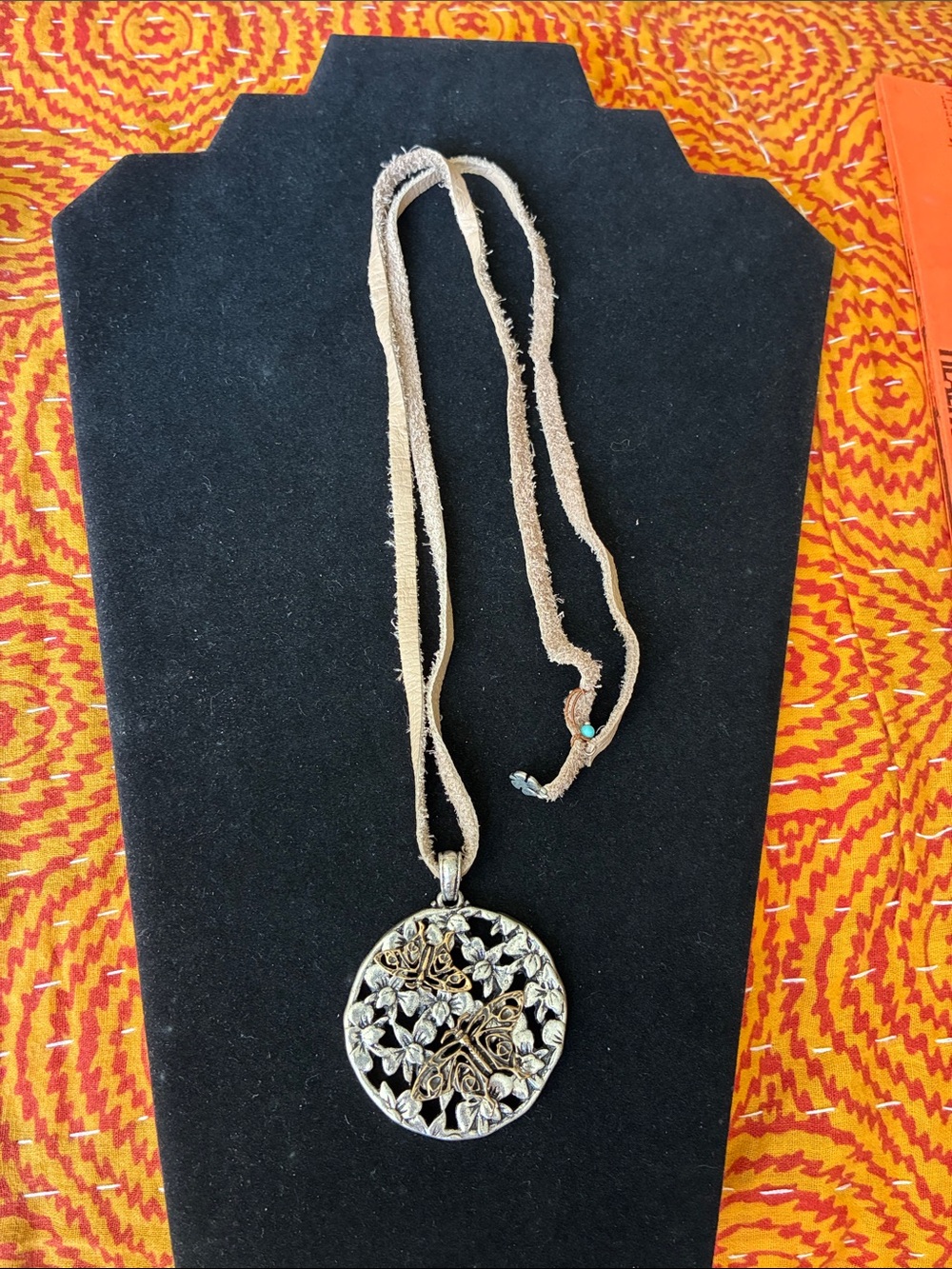 Lucky pendant on suede cord